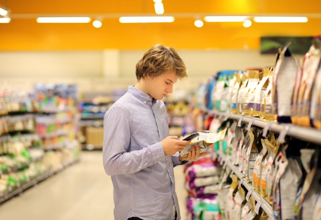 GenZ Examining Package with Phone